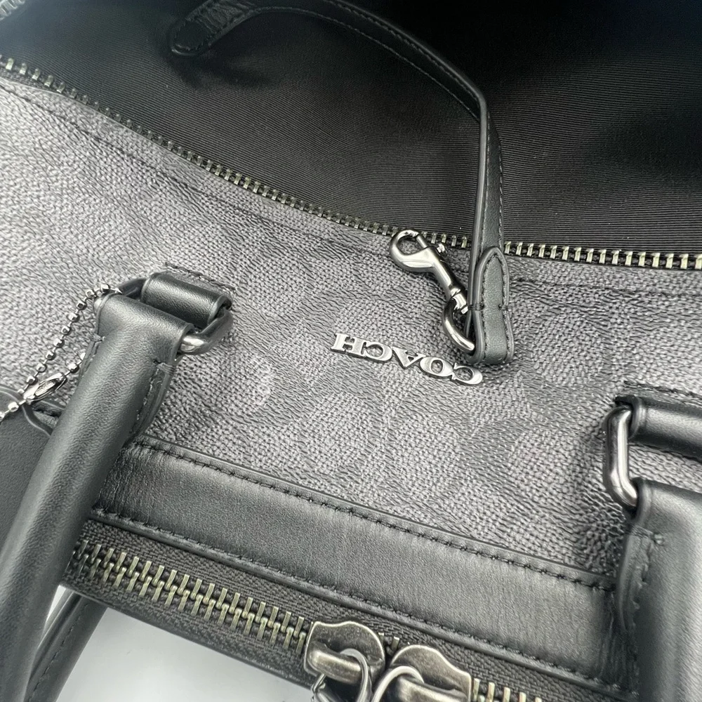 Coach Slim Brief In Signature Canvas With Trolley Sleeve